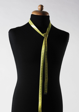 dressmaker's dummy with measuring tape