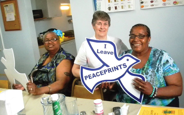 Vision 2016 Oatis 3 Feeding the poor enriches the lives of sisters At a Women’s Empowerment Dinner, two attendees receive Peace Doves.