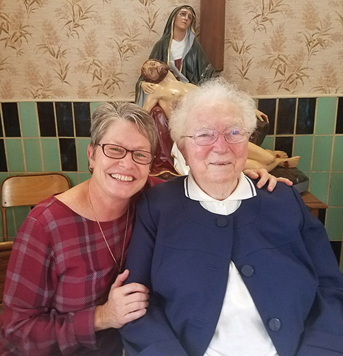 Vision 2019 Daigle 2 Vows set you free Sister Renée Daigle, M.S.C. gives a hug to fellow Marianite Sister Marie Renée Moreau.