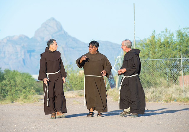 Vision 2021 Schuck Scheiber 11 A day in the life of a Franciscan missionary Friars David Paz, O.F.M. (left), Father Ponchie Vásquez, O.F.M. (center), and Peter Boegel, O.F.M. (right) take an evening walk with the sacred mountain Baboquivari in the distance.