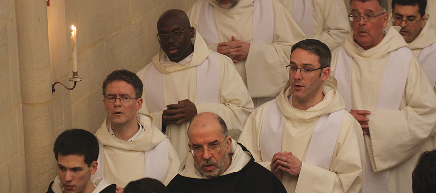 The community sings as they process out of church