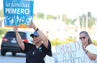 Sister Joni Luna, S.P. (left) takes part in a demonstration of solidarity with migrants, immigrants, and refugees.